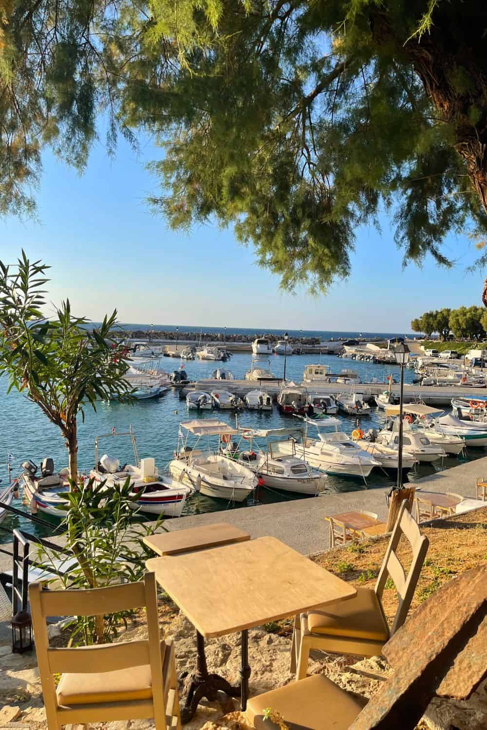 The marina in Crete with a dining table and 2 chairs