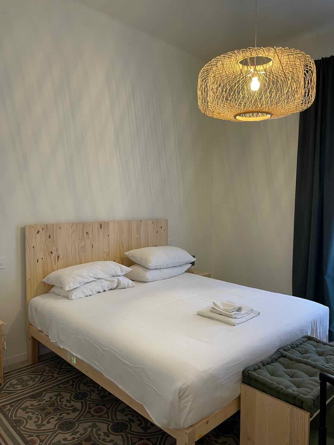 a bed in a modern hotel room.