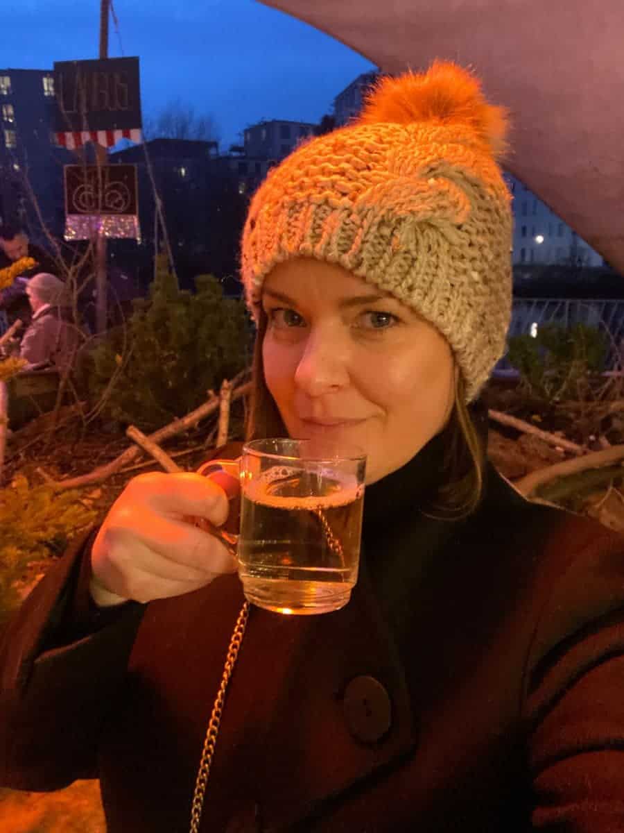 A woman drinking hot wine in Verona
